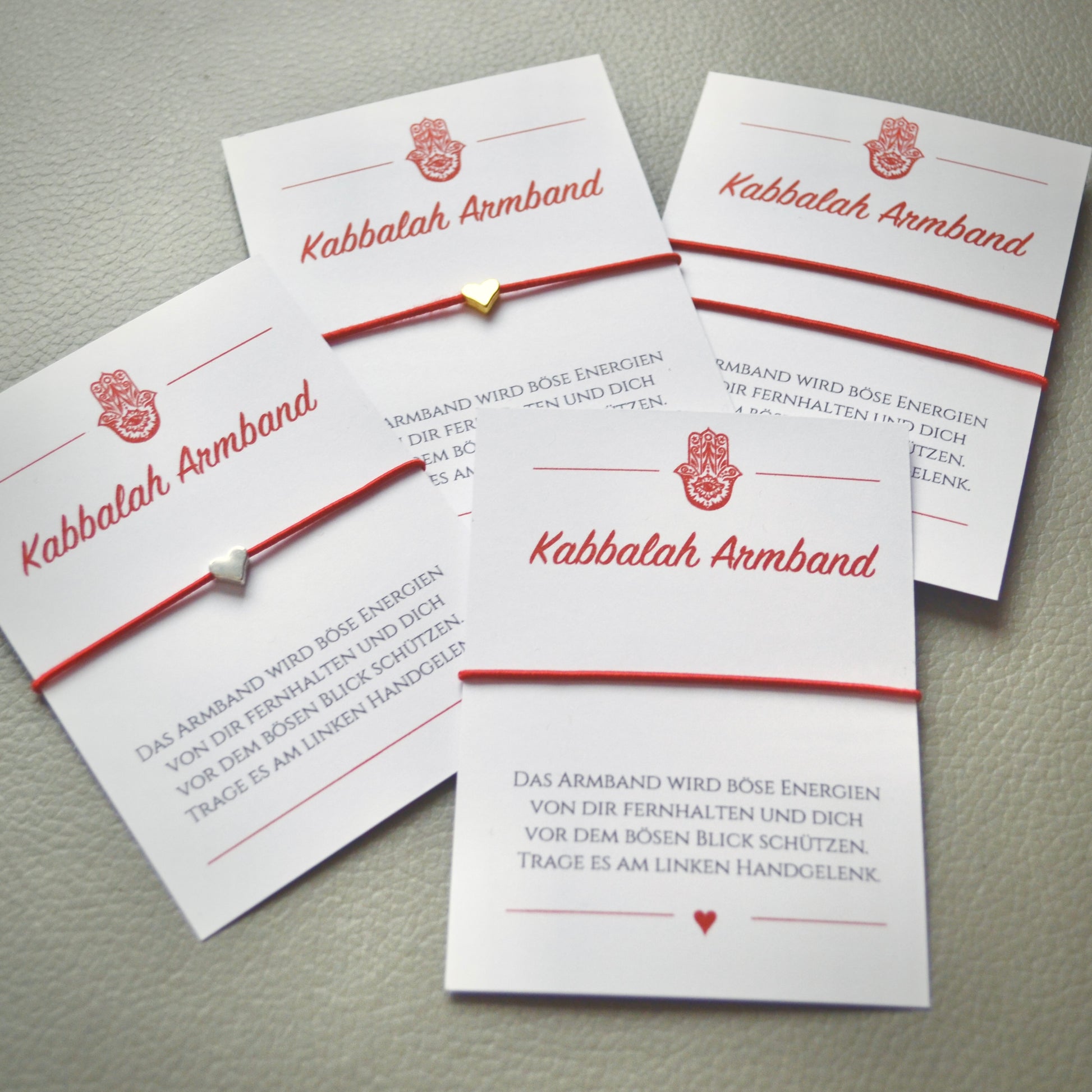 Handgefertigtes Kabbalah Armband mit rotem Band und Herz in Gold oder Silber als spirituelles Schutzarmband gegen den bösen Blick – Geschenk für Frauen und Männer.